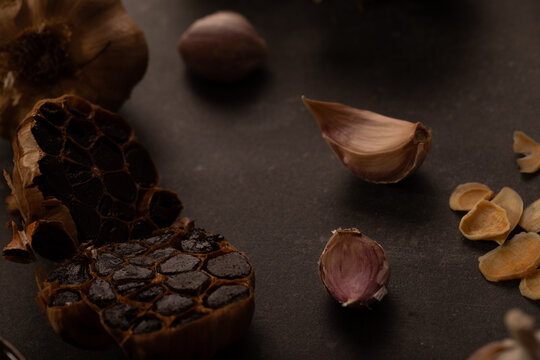 Garlic bulb cut in half to show smoked cloves