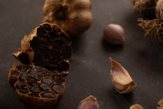 Garlic bulb cut in half to show smoked cloves