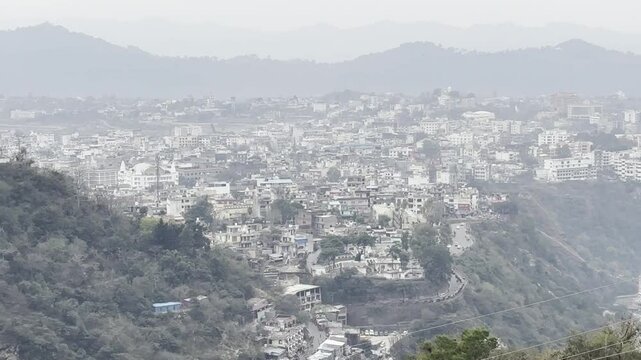 Cinematic footage capturing the spiritual journey and vibrant atmosphere of the Vaishno Devi pilgrimage in Katra, nestled in the scenic Trikuta Mountains of Jammu and Kashmir.