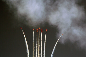 Red Arrow Aerobatic Planes Performing a High Altitude Display with Contrail Effects on isolated...