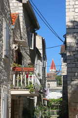 Picturesque Mediterranean street and traditional architectural details in Trogir, Croatia.