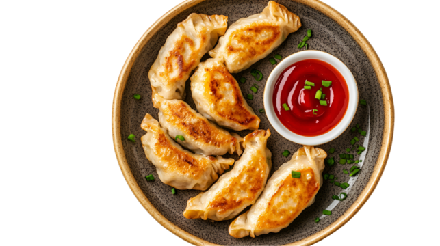 Full frame shot of freshly homemade raw Chinese dumplings arranged in tight rows on a bamboo kitchen plate