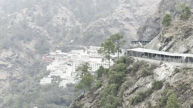 Cinematic footage capturing the spiritual journey and vibrant atmosphere of the Vaishno Devi pilgrimage in Katra, nestled in the scenic Trikuta Mountains of Jammu and Kashmir.
