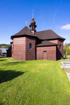 Wooden church standing in Velke Karlovice, Czechia, under blue sky
