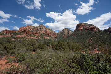 Sedona, Arizona, red rock formations and scenic landscapes under dramatic cloud-filled skies, capturing the natural beauty of the desert wilderness.