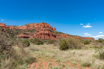 Sedona, Arizona, red rock formations and scenic landscapes under dramatic cloud-filled skies, capturing the natural beauty of the desert wilderness.