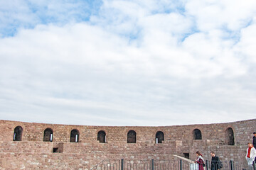 Ancient Fortress Wall: Exploring History Under a Cloudy Sky