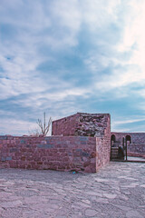 Ancient Ruins: Majestic Stone Walls and Cloudy Sky - Architectural Photography