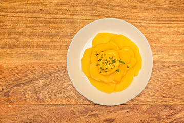 Papa a la huancaína: Boiled potatoes covered in a creamy sauce made from cheese and yellow chili, a classic of Peruvian cuisine 02