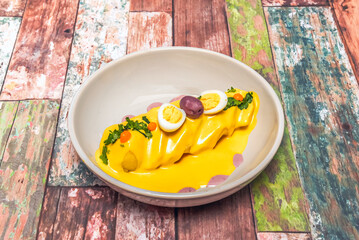 Papa a la huancaína is a typical starter in Peruvian cuisine. It is one of the most popular and representative culinary items