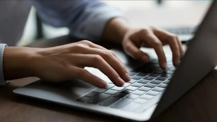 Hands typing on laptop keyboard. Business person working on computer. - Powered by Adobe