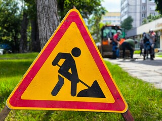 road sign repair work on the road. Road sign attention road works underway