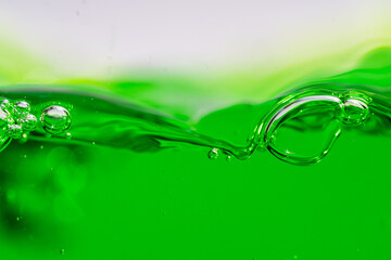 Water wave, close up of vibrant green liquid with bubbles, capturing dynamic movement and freshness. Perfect for backgrounds, beverages, or abstract concepts. soft drink