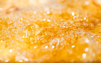 Close up bright orange Oil or beer splash texture and nature waves, Beautiful waves curve and...