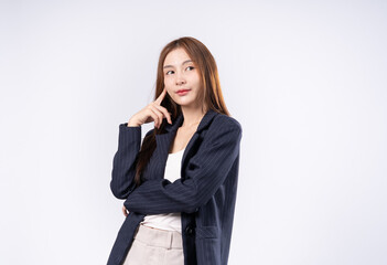 Beautiful Asian woman with brown hair in suit posing thinking portrait in studio on white background