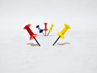 colorful push pins on white background