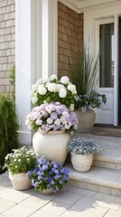 White Purple and Blue Flowers in Stone Planters on Front Porch