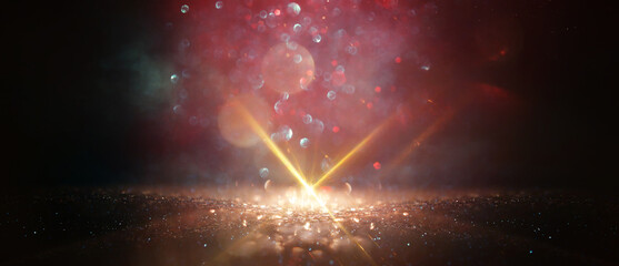 abstract glitter black and gold lights background. de-focused