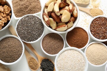 Different superfoods on white background, flat lay