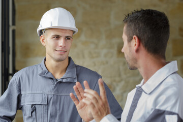 construction workers talking in construction site