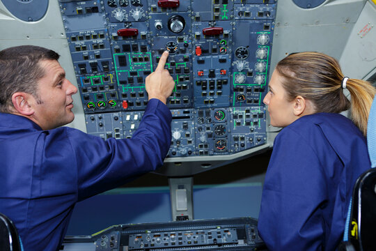 airplane engineers checking the cokpit