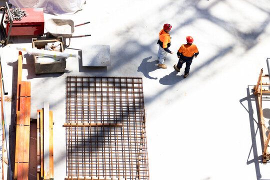 Two workers in a construction site having a meeting