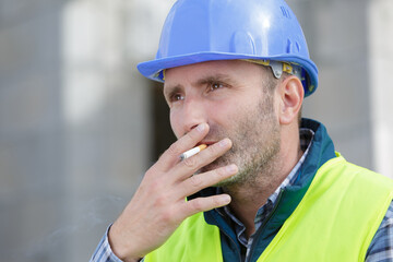 smoking cigarette on construction site