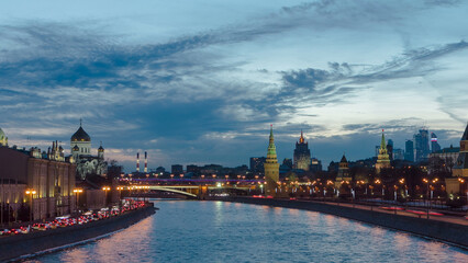 Obraz premium Ensemble of Moscow Kremlin and Moskva-City business center view across Moskva river at a winter day to night timelapse hyperlapse