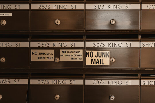 No junk mail signs on apartment building letter boxes