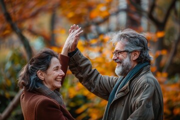 Portrait of a blissful couple in their 40s giving high five