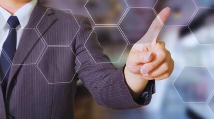 Businessman in a suit touching a virtual screen, symbolizing future business success through digital interface technology