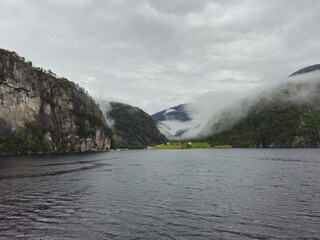 Mostraumen village in Norway with beautiful fjord and mist