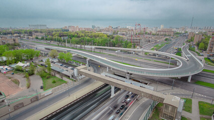 Fototapeta premium Traffic jams of roadside, transportation motion in a big city. Rush hour traffic on a city roads aerial timelapse.