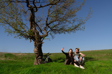 Couple Enjoying Outdoor Picnic and Taking a Selfie