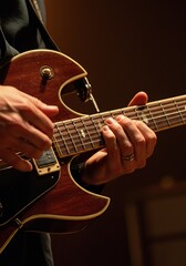Fototapeta premium Tight close up of skilled hands playing guitar strings showing finger positioning tension and emotional connection to music