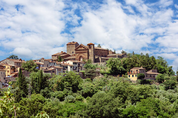 The medieval village of Montecatini Alto, located in the province of Pistoia in Italy, is nestled atop a hill and showcases its beautiful medieval architecture surrounded by lush greenery.