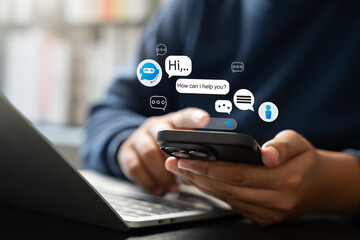 Businessman uses AI chatbot on smartphone for digital communication and customer service. Smart virtual artificial intelligence assistant, Intelligent system in today business and daily life world.