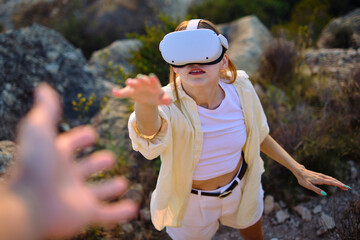 Immersive virtual reality adventure: woman exploring outdoors with vr headset