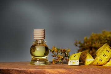 Hypericum - St. St. John's wort herbs, oil or infusion bottle, mortar on a wooden board.