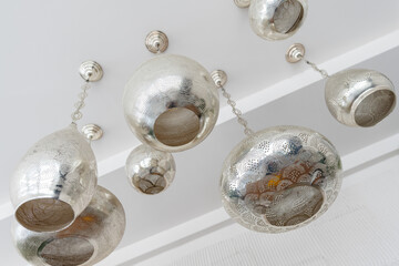 Decorative metallic ceiling lamps featuring elaborate patterns