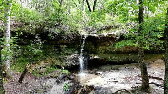 Slow pass over a small waterfall in South Carolina with dappled sunlight