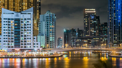Obraz premium Dubai Marina towers and canal in Dubai night timelapse