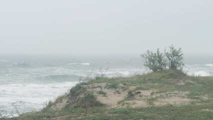 Sea view during bad weather. Rain starts over the sea. Before the storm on the coast.