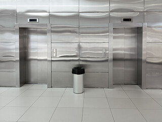Silvery grey closed elevator doors in a building.