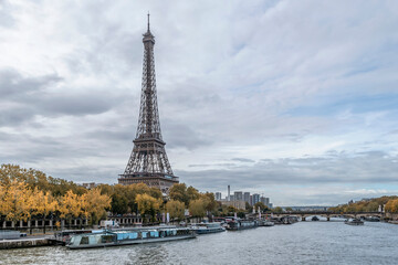 The Seine river and the Eiffel Tower in Paris, France, in the autumn season