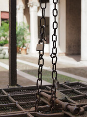 Ferrara castle, northern Italy, internal courtyard. Detail of the well chain.