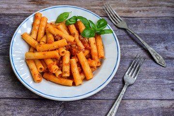  Pasta bolognese .Italian home made meal Fresh   maccheroni pasta with tomato sauce, basil, herbs ,parmesan cheese ,fresh cherry tomatoes and parsley on wooden background. Kitchen Poster 