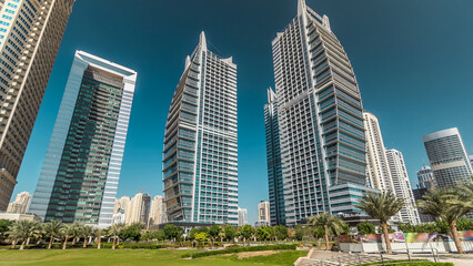 Obraz premium Residential buildings in Jumeirah Lake Towers timelapse hyperlapse in Dubai, UAE.