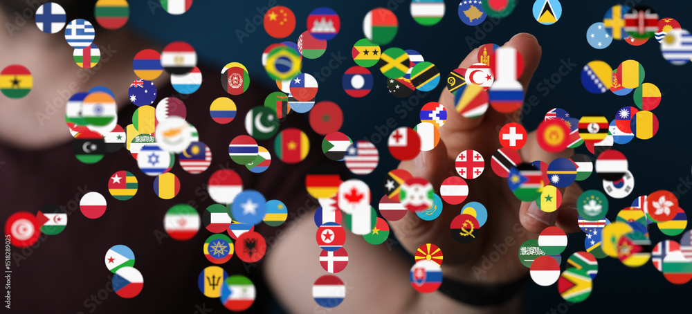 Leinwandbilder person interacting with a digital display of world flags, symbolizing global connection and communic