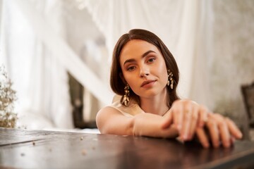 Elegant young woman showcasing beauty in a charming setting